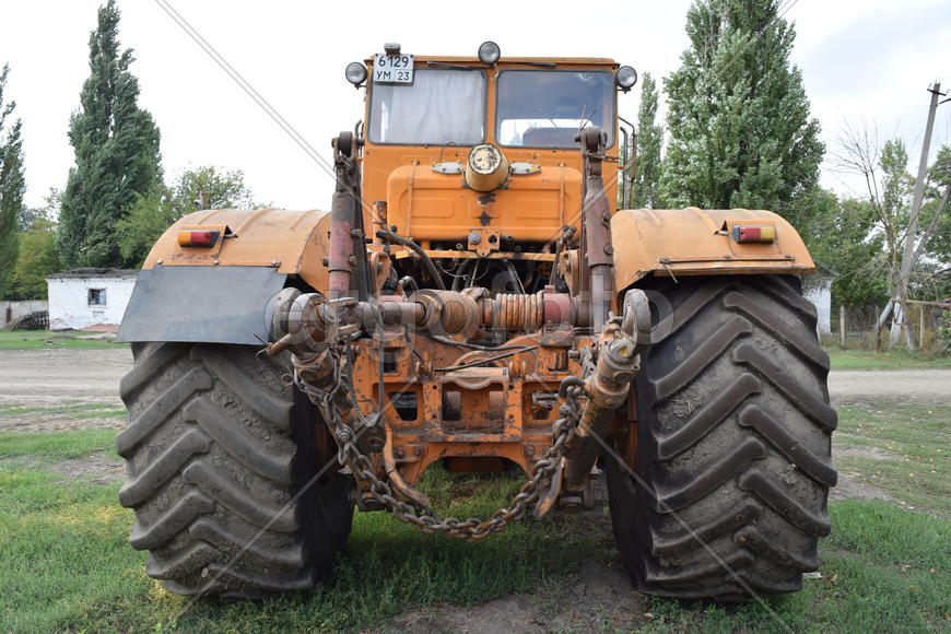 Tractor, standing in a row. Agricultural machinery. Parking of agricultural machinery.
