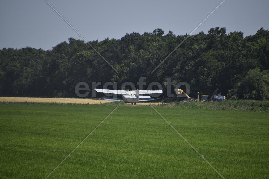 Aircraft agricultural aviation AN-2. The spraying of fertilizers and pesticides on the field with th
