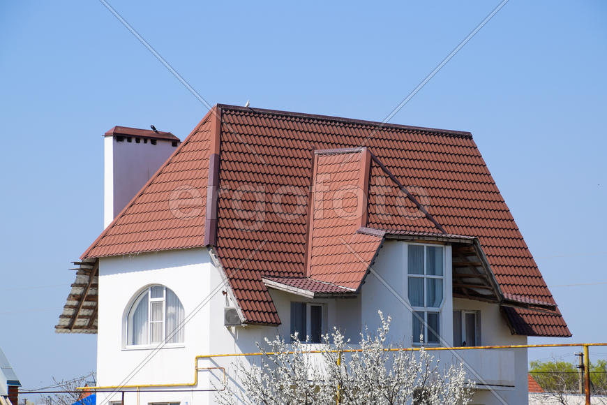 The roof of corrugated sheet on the houses.