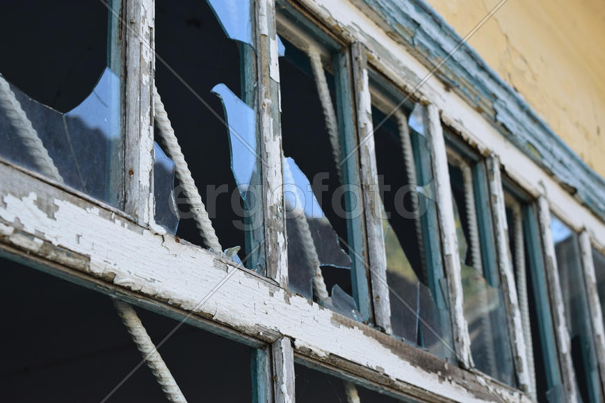 Windows with the broken glasses. The old thrown gas station