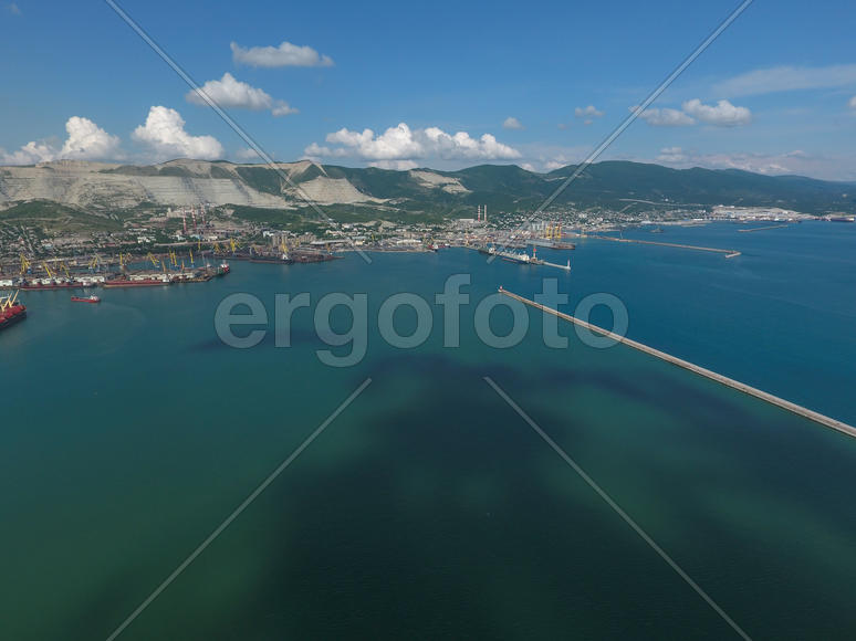 Top view of the bay Tsemess. The international sea port of Novorossiysk. Mol - building to stop the 