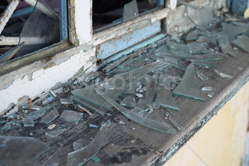 Windows with the broken glasses. The old thrown gas station