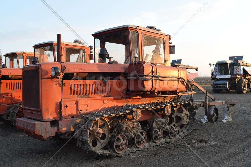 Russia, Temryuk - 15 July 2015: Tractor, standing in a row. Agricultural machinery. Parking of agric