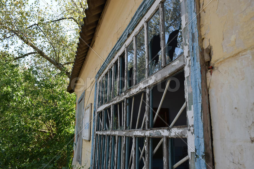 Windows with the broken glasses. The old thrown gas station