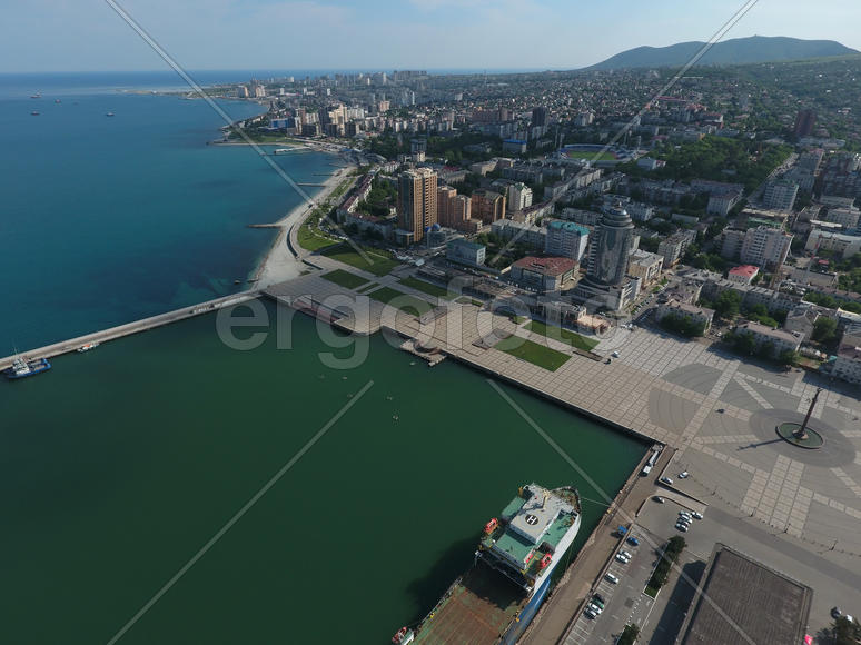 Top view of the marina and quay of Novorossiysk. Urban landscape of the port city.