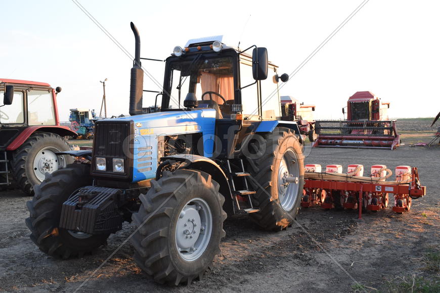 Russia, Temryuk - 15 July 2015: Tractor, standing in a row. Agricultural machinery. Parking of agric