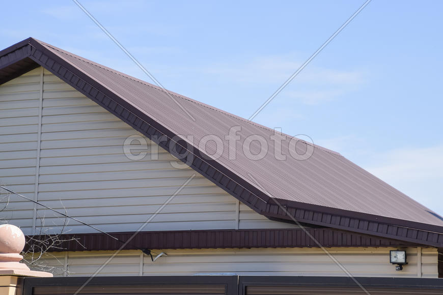 The roof of corrugated sheet. Roofing of metal profile wavy shape.