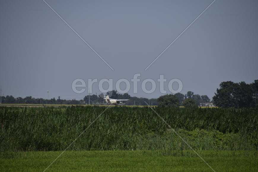 Aircraft agricultural aviation AN-2. The spraying of fertilizers and pesticides on the field with th