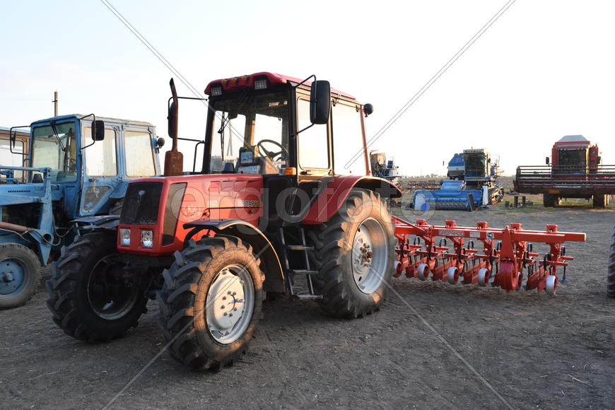 Russia, Temryuk - 15 July 2015: Tractor, standing in a row. Agricultural machinery. Parking of agric