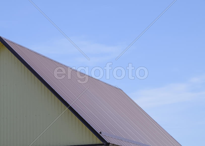 The roof of corrugated sheet. Roofing of metal profile wavy shape.