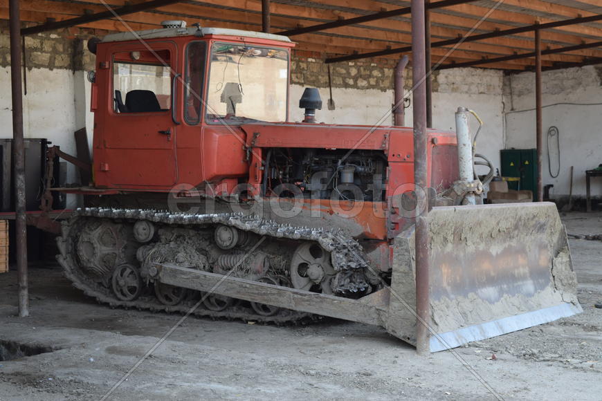 Tractor, standing in a row. Agricultural machinery. Parking of agricultural machinery.