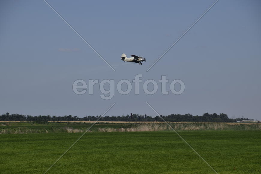 Aircraft agricultural aviation AN-2. The spraying of fertilizers and pesticides on the field with th