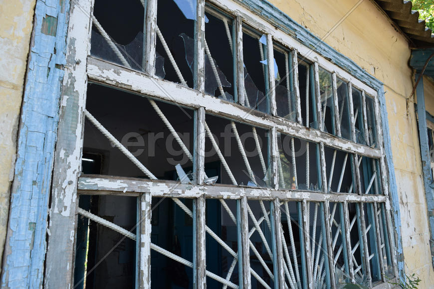 Windows with the broken glasses. The old thrown gas station