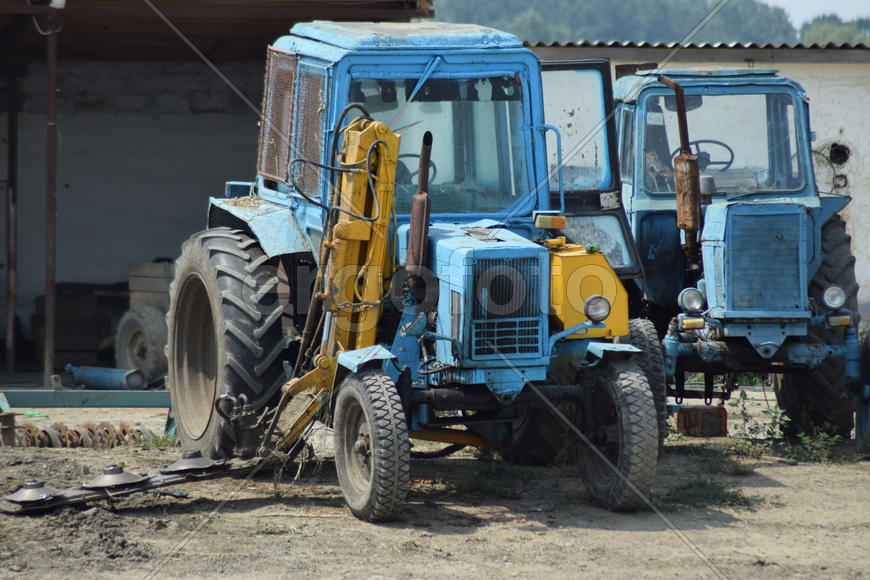 Russia, Temryuk - 15 July 2015: Tractor, standing in a row. Agricultural machinery. Parking of agric