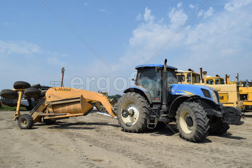 Russia, Temryuk - 15 July 2015: Tractor, standing in a row. Agricultural machinery. Parking of agric
