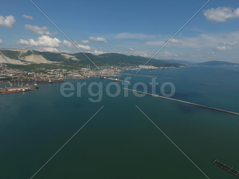 Top view of the bay Tsemess. The international sea port of Novorossiysk. Mol - building to stop the 