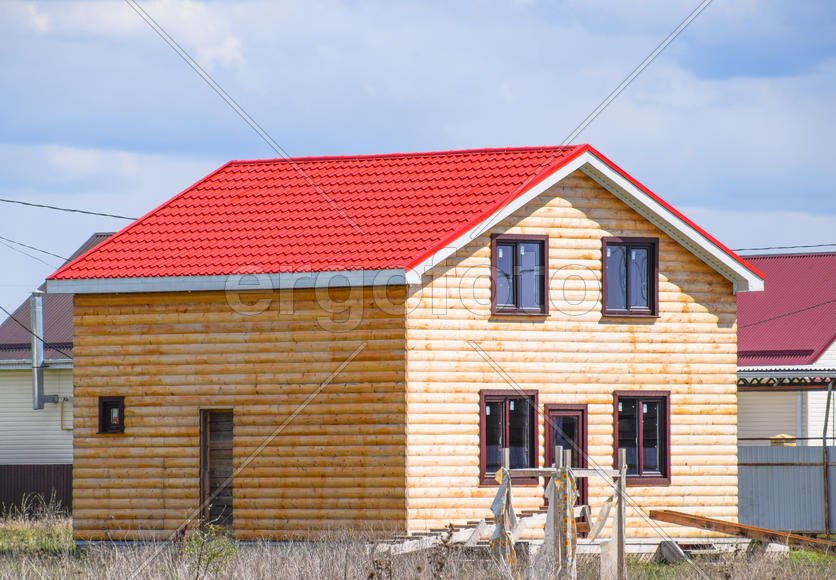 The roof of corrugated sheet on the houses. 