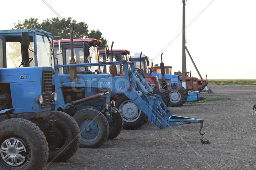 Russia, Temryuk - 15 July 2015: Tractor, standing in a row. Agricultural machinery. Parking of agric
