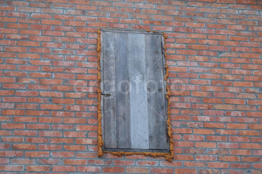 The wooden door of the attic. Detached house in the village