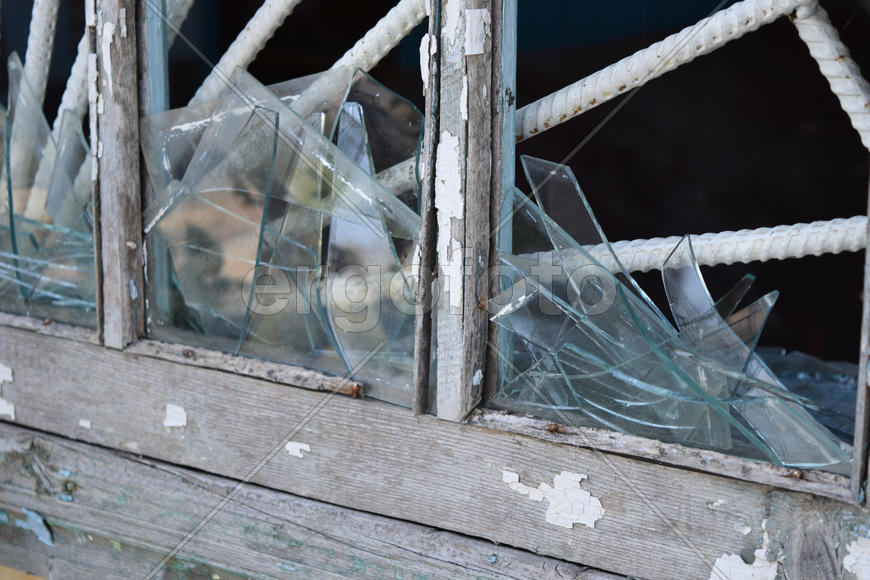 Windows with the broken glasses. The old thrown gas station
