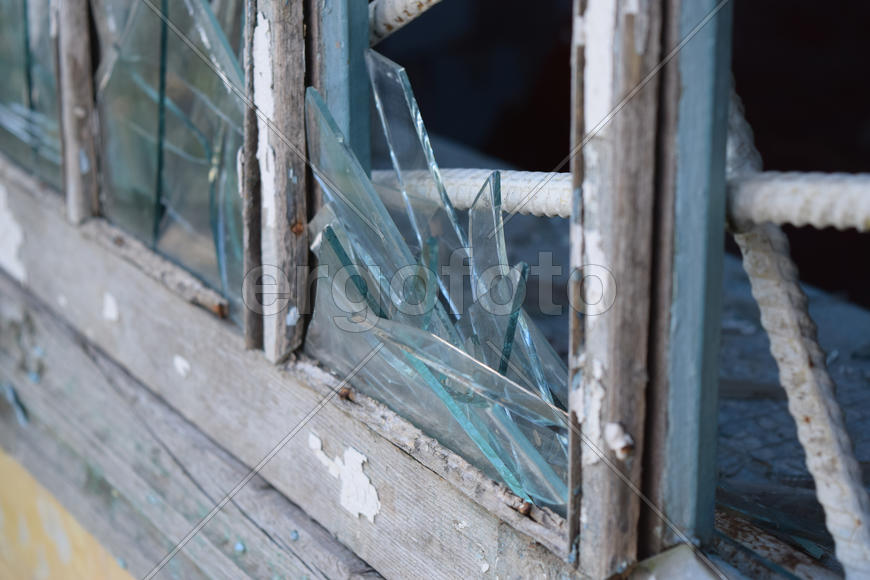 Windows with the broken glasses. The old thrown gas station