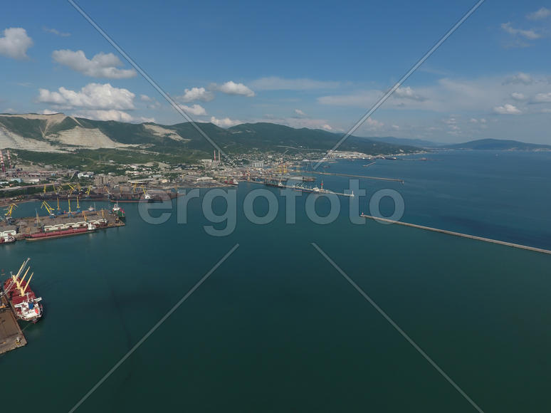 Top view of the bay Tsemess. The international sea port of Novorossiysk. Mol - building to stop the 