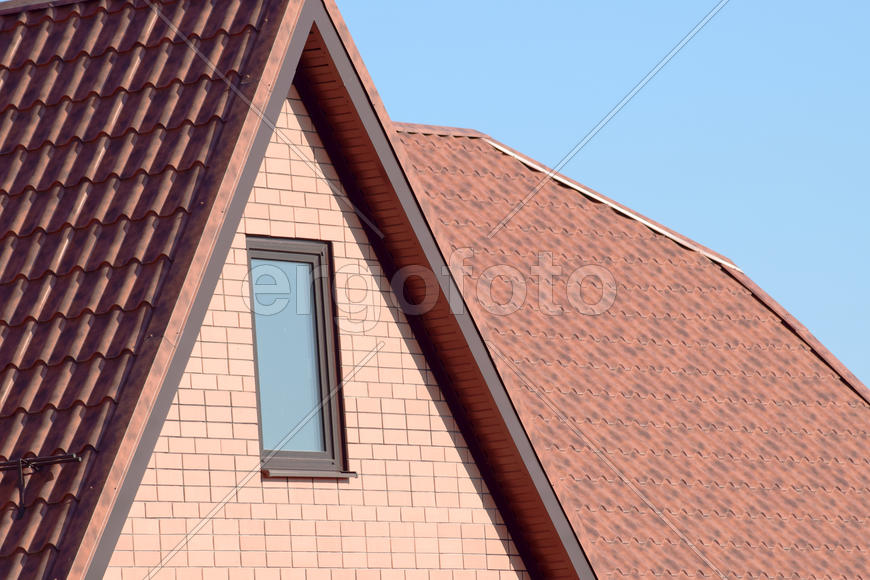 The roof of corrugated sheet. Roofing of metal profile wavy shape.