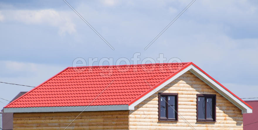 The roof of corrugated sheet on the houses. I