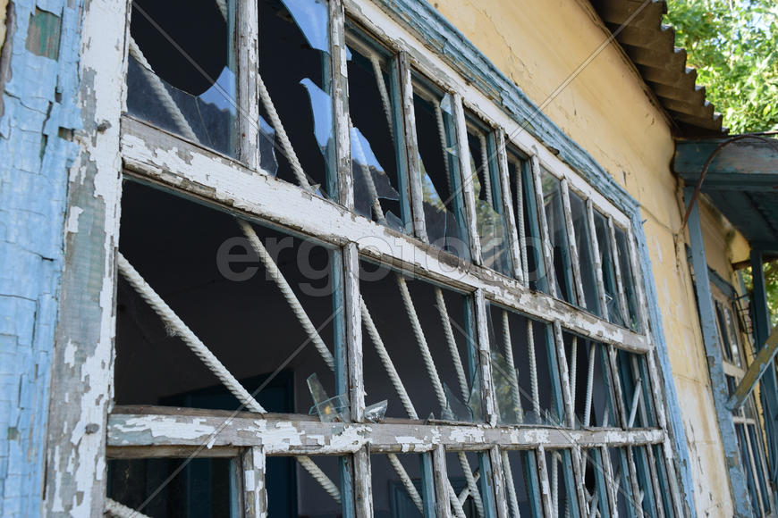 Windows with the broken glasses. The old thrown gas station