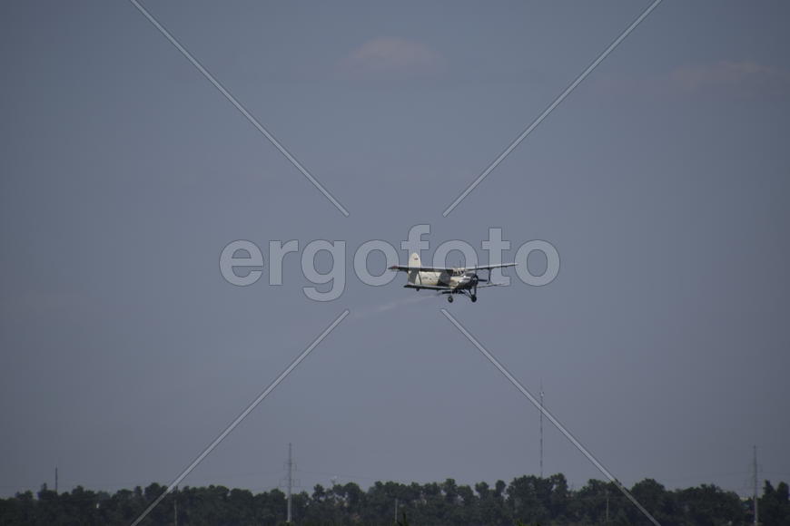 Aircraft agricultural aviation AN-2. The spraying of fertilizers and pesticides on the field with th