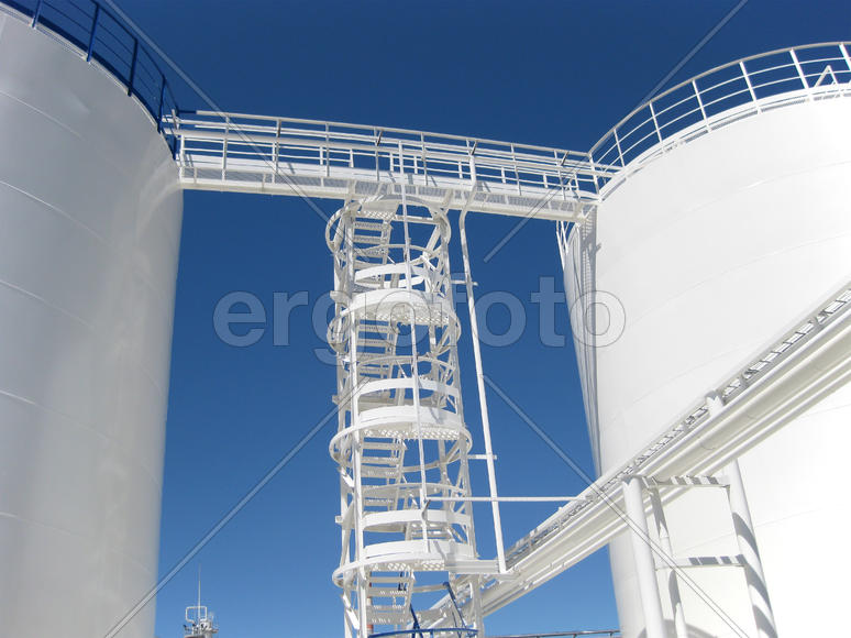 The tank with water and a ladder. Equipment for primary oil refining