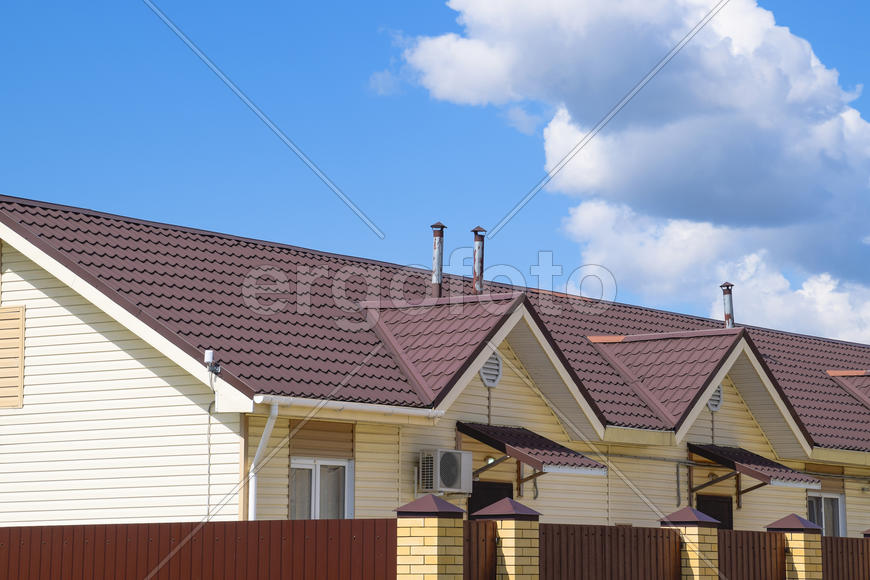 The roof of corrugated sheet on the houses. 