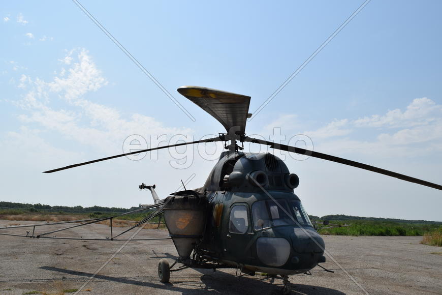 Old helicopter spraying fields. Helicopter spraying fertilizer.