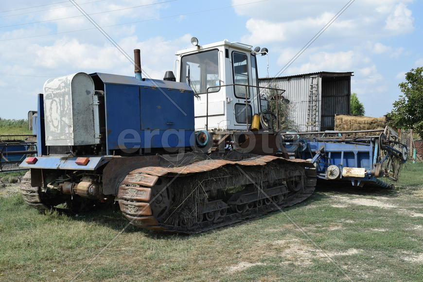 Tractor, standing in a row. Agricultural machinery. Parking of agricultural machinery.