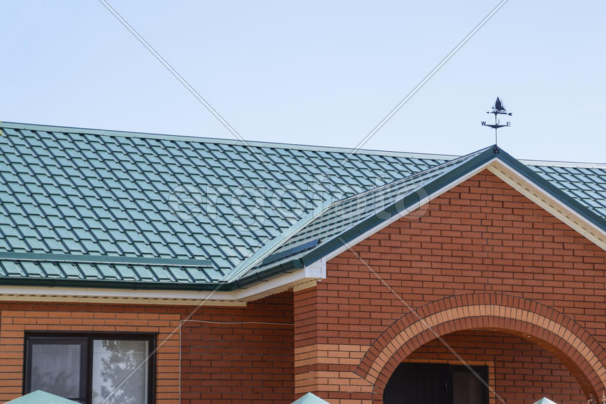 The roof of corrugated sheet. Roofing of metal profile wavy shape.