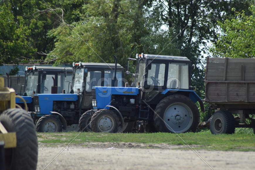 Russia, Temryuk - 15 July 2015: Tractor, standing in a row. Agricultural machinery. Parking of agric