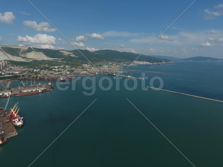 Top view of the bay Tsemess. The international sea port of Novorossiysk. Mol - building to stop the 