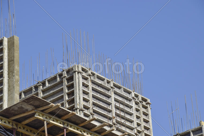 Construction of a multistory building. Installation of the concrete walls of the building.