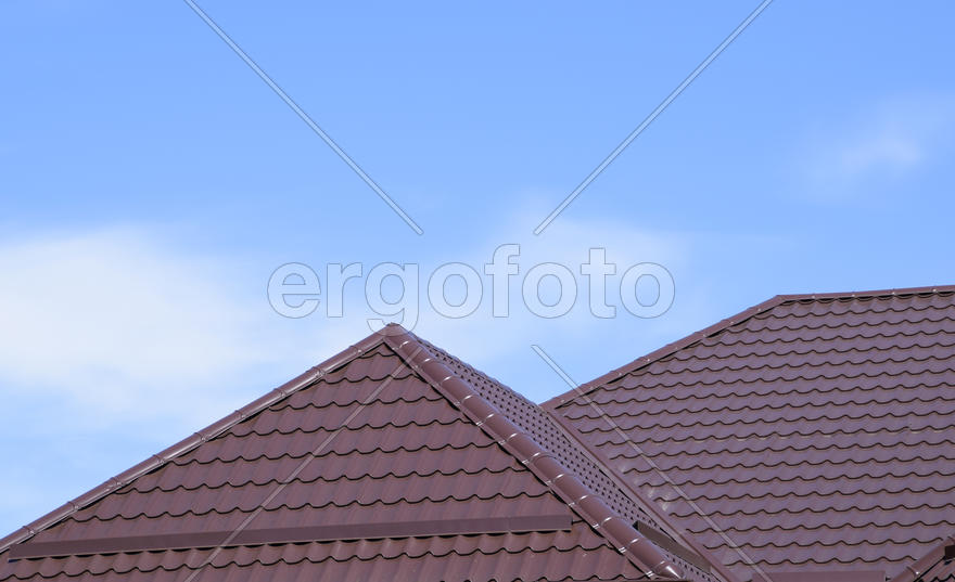 The roof of corrugated sheet. Roofing of metal profile wavy shape.