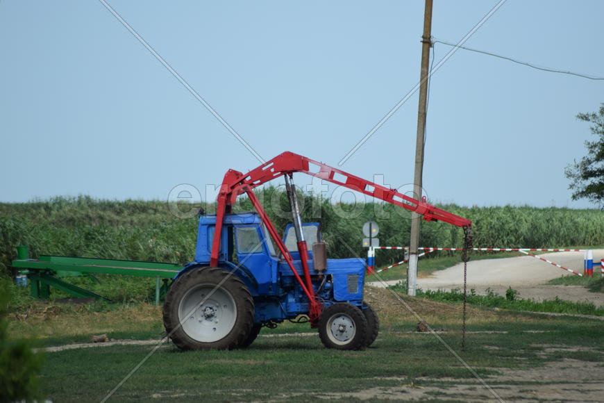 Russia, Temryuk - 15 July 2015: Tractor, standing in a row. Agricultural machinery. Parking of agric