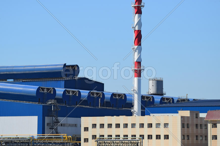 Big plant for processing scrap metal. Huge factory old metal refiner. Blue roof of the factory build