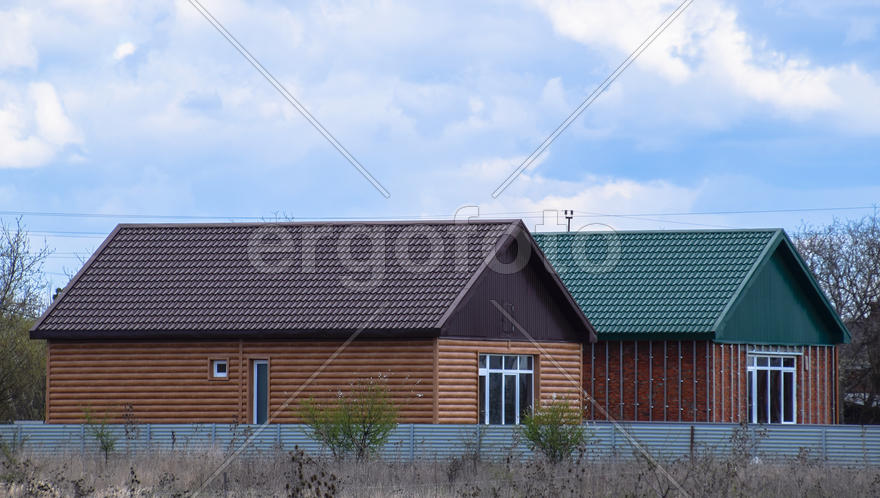 The roof of corrugated sheet on the houses. 