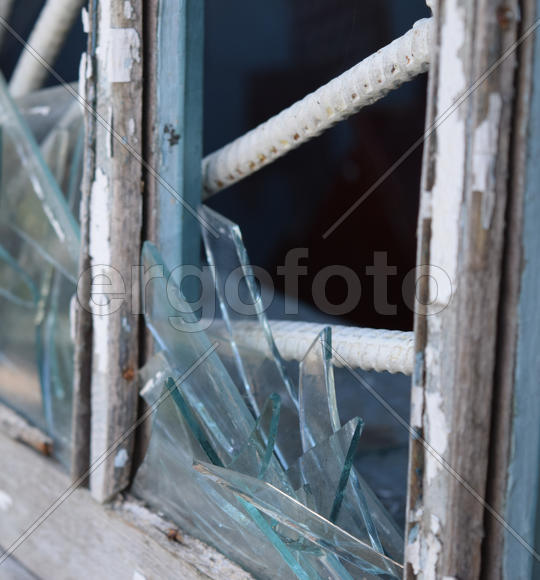 Windows with the broken glasses. The old thrown gas station