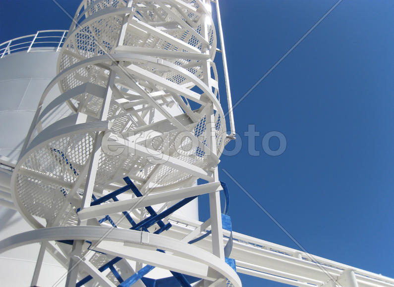The tank with water and a ladder. Equipment for primary oil refining