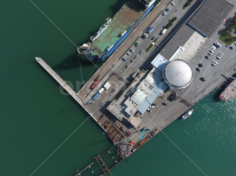 Top view of the marina and quay of Novorossiysk. Urban landscape of the port city.