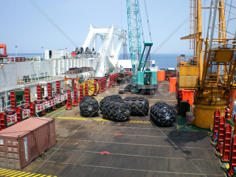 The cargo ship with the crane, the top view. Pipelaying barge