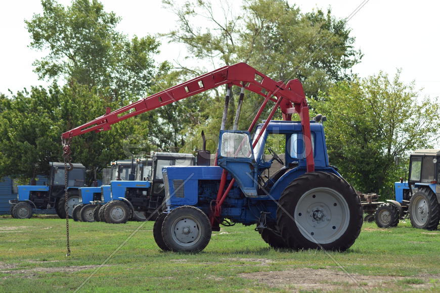 Russia, Temryuk - 15 July 2015: Tractor, standing in a row. Agricultural machinery. Parking of agric