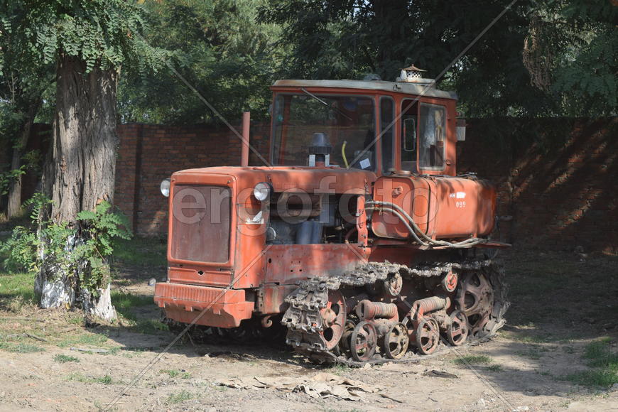 Tractor, standing in a row. Agricultural machinery. Parking of agricultural machinery.