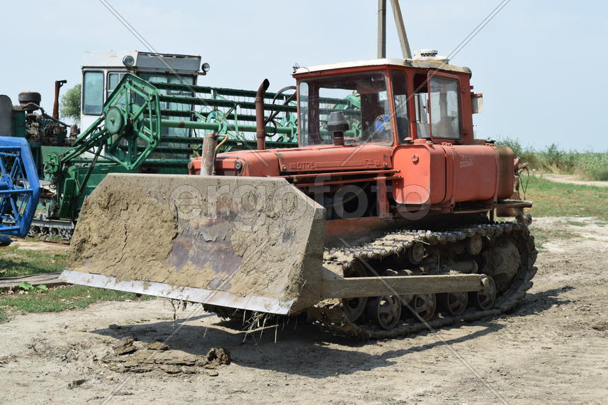 Russia, Temryuk - 15 July 2015: Tractor, standing in a row. Agricultural machinery. Parking of agric