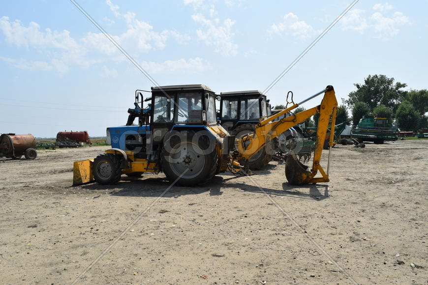 Russia, Temryuk - 15 July 2015: Tractor, standing in a row. Agricultural machinery. Parking of agric